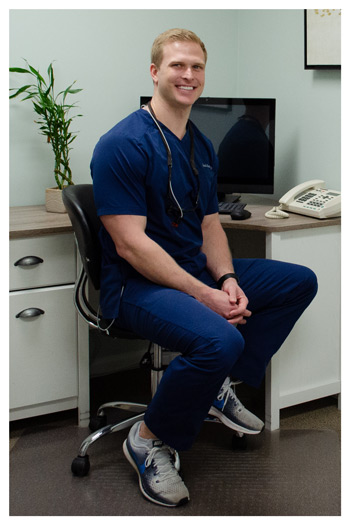 Dr. Stueve sits at his desk